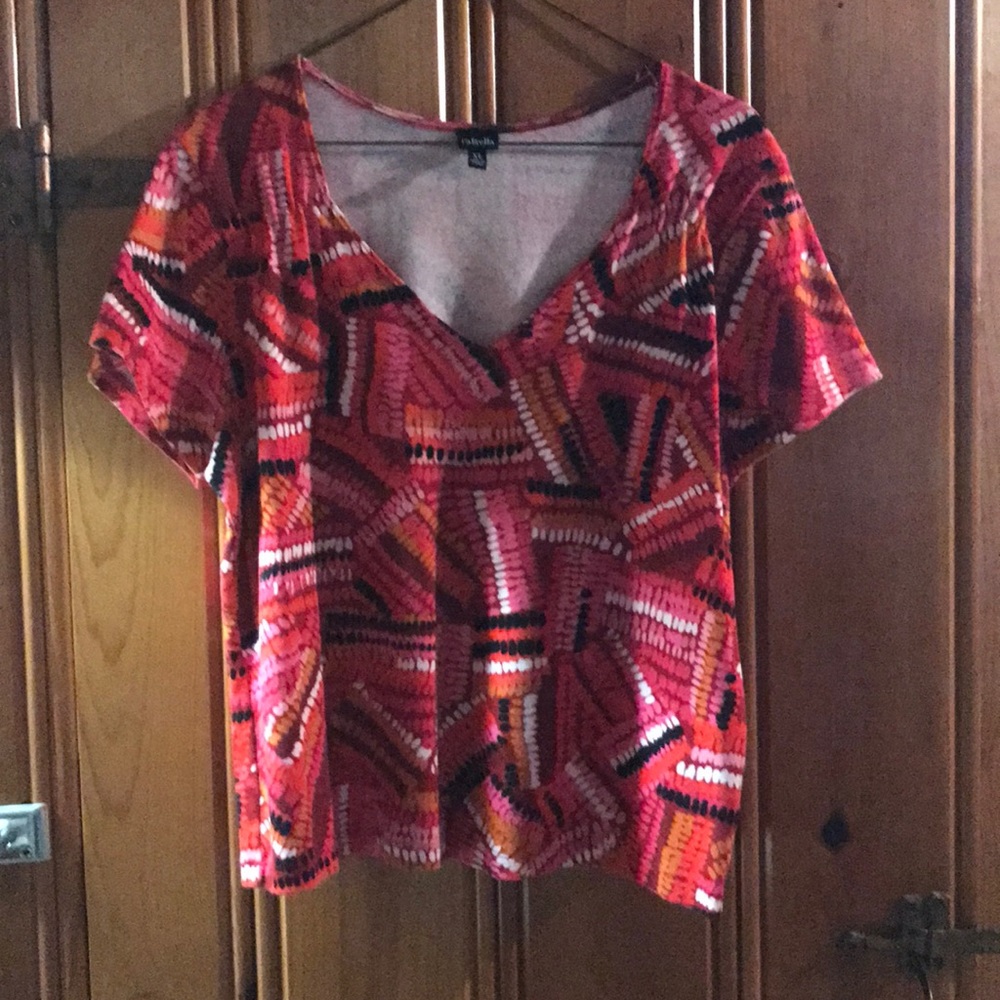 T shirt. Multi colored red, pink, black & white.